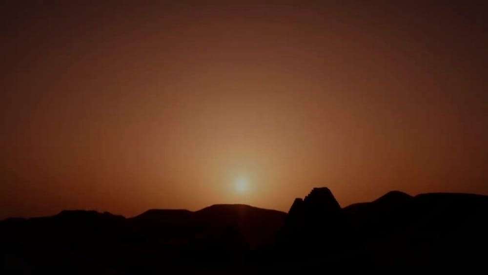 The sun sets behind dark hills. A frame from the trailer of Survivors.